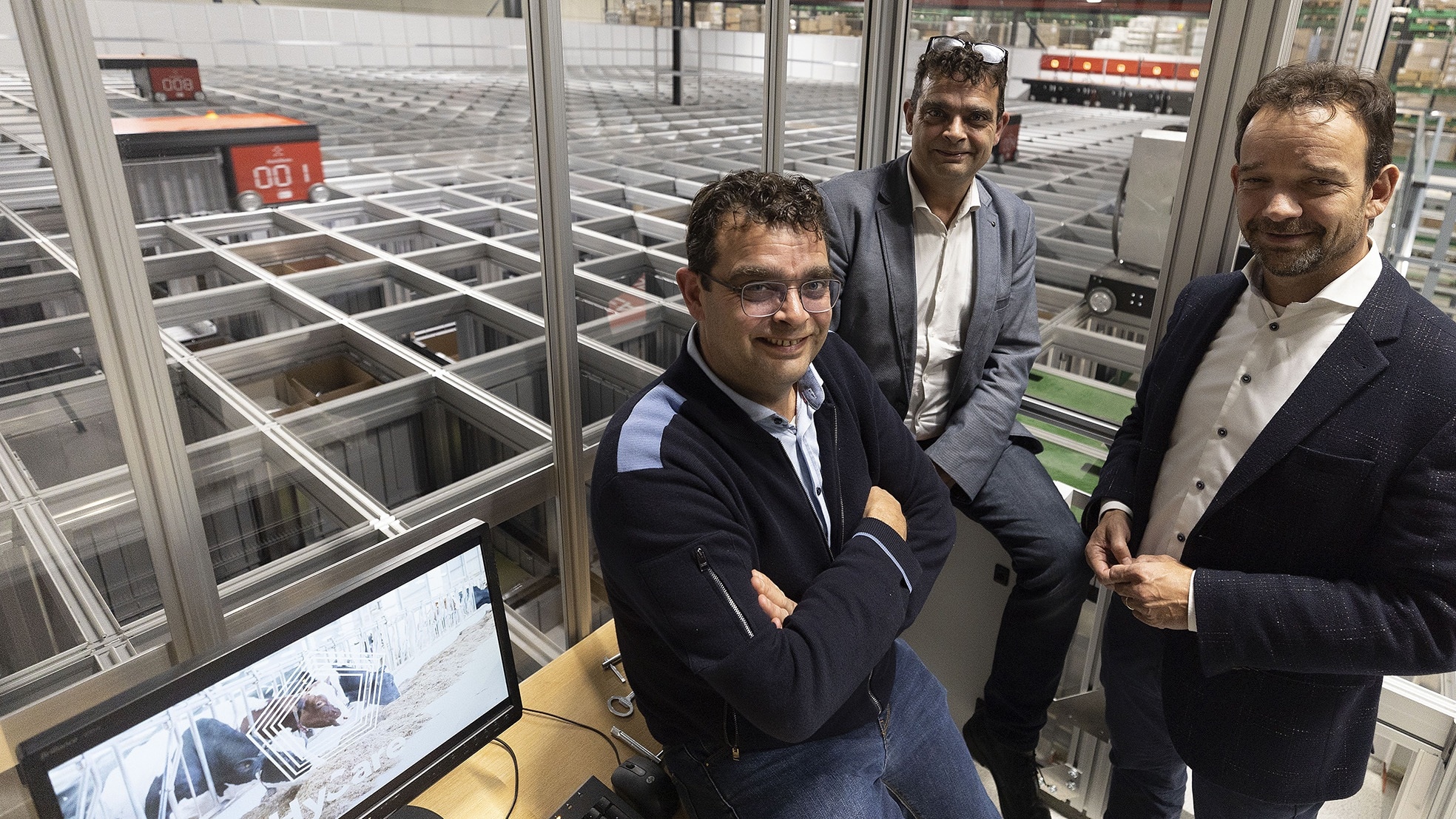 Directieleden Guus, Harrie en Mark Schippers (van links naar rechts) in het deels geautomatiseerde nieuwe distributiecentrum van The Schippers Group in Hapert. Foto: Kees Martens/DCI Media